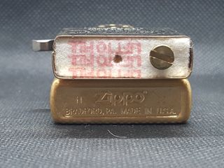 Zippo 2022 Model 49477 Tumbled Brass, Golfer.