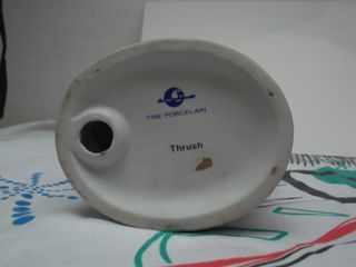 Figura pajarito porcelana