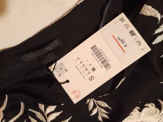 Top asimétrico flecos ZARA