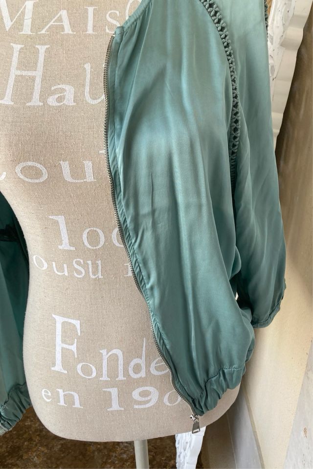 Blusa turquesa cremallera delantera