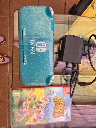 Nintendo Switch azul, cargador y Animal Crossing