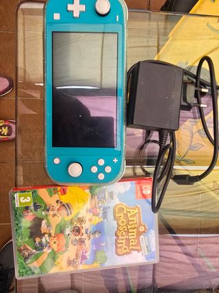 Nintendo Switch azul, cargador y Animal Crossing