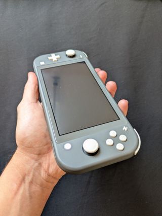 Nintendo Switch Lite + Cartucho Mágico + Extras