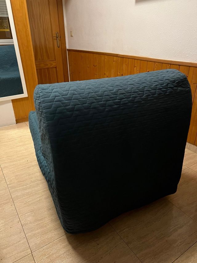 Sillón cama verde oscuro con funda