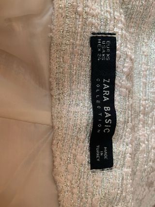 Mini falda tweed beige-rosa con plumas ,elegante
