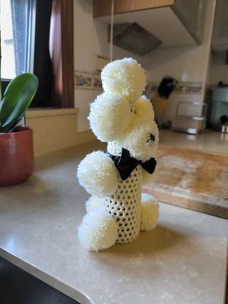 2 peluches perros pompon