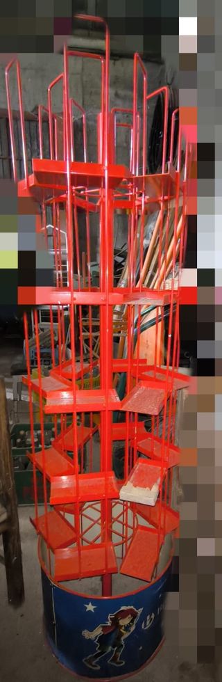 espositore metallico rosso per libri