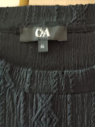 Blusas negra y negra con lunares