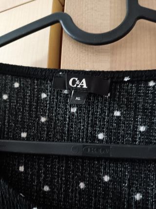 Blusas negra y negra con lunares