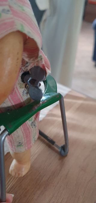 Antica bambola meccanica in metallo m