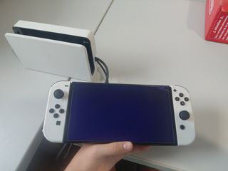 Giochi OLED + custodia per Nintendo Switch.    
