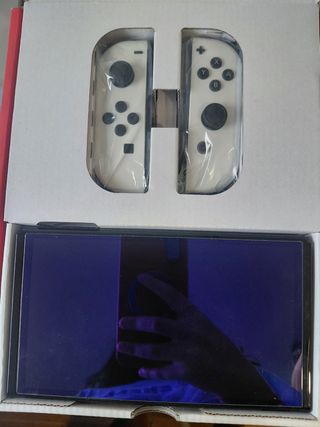 Giochi OLED + custodia per Nintendo Switch.    
