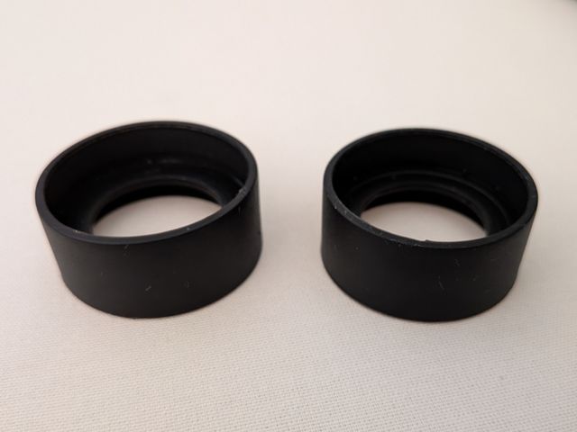 Par de protectores de goma para ocular microscopio