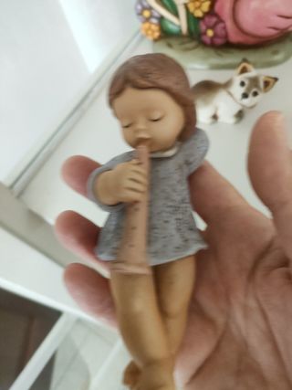 Statuina bimba Goebel: flauto