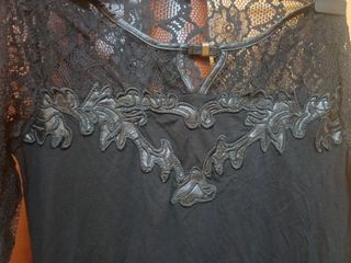 Maglia in pizzo e pelle,maniche in pizzo  elegante