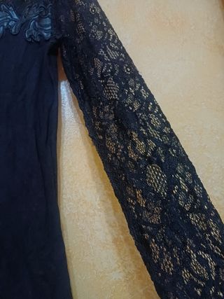 Maglia in pizzo e pelle,maniche in pizzo  elegante