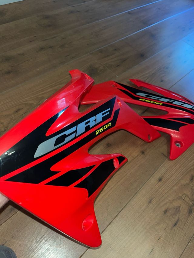 Tapas laterales deposito CRF250R