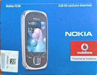 Móvil Nokia 7230 con cargador y batería