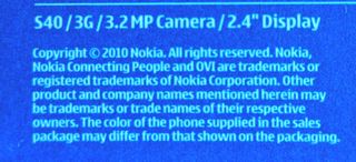 Móvil Nokia 7230 con cargador y batería