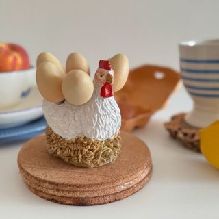 Gallina rústica con nido y cuchillos de acero