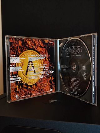 CD Artifacts - Between A Rock
