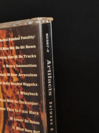 CD Artifacts - Between A Rock