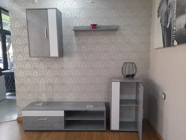 Muebles salón gris y blanco