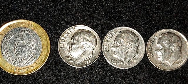 3 Dimes EEUU uno de ellos le falta el contorno