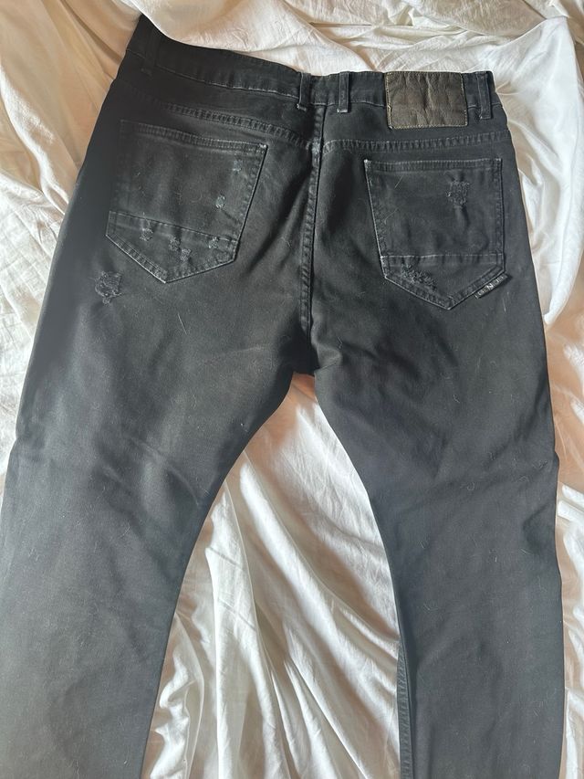 Jeans Genius neri strappati