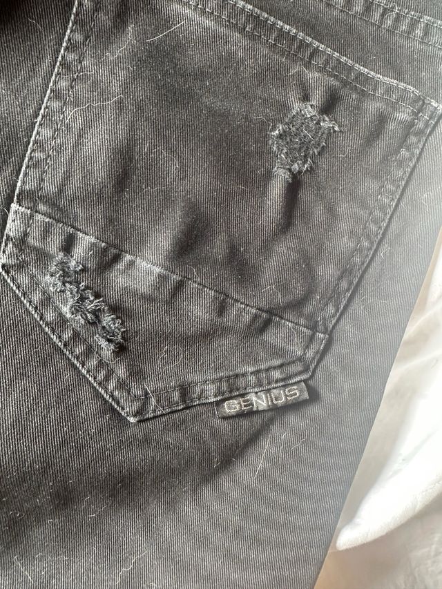 Jeans Genius neri strappati