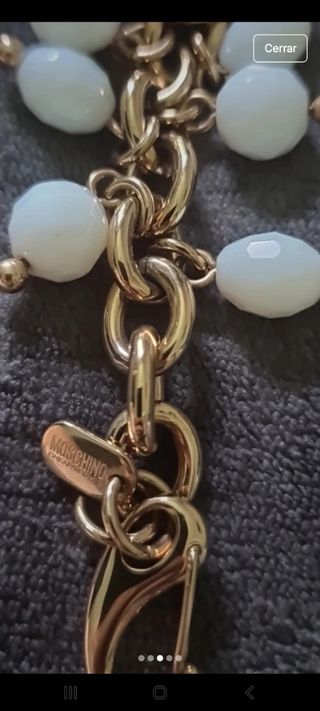 Reloj Moschino dorado y blanco