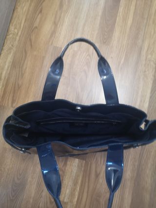 Cuatro bolsos de mano sin uso