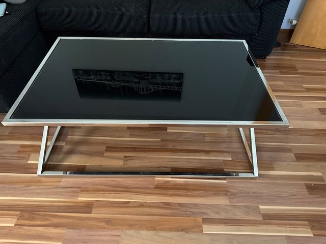 Mesa centro  cristal negra y patas metalicas