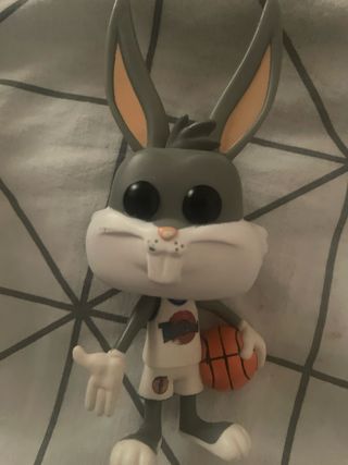 4 Funko Pops: Bugs Bunny, Batman, etc.