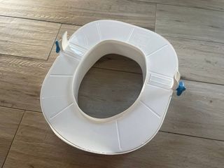 Asiento elevador WC blanco