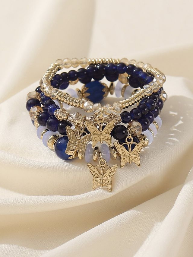 Pulseras boho azules y doradas