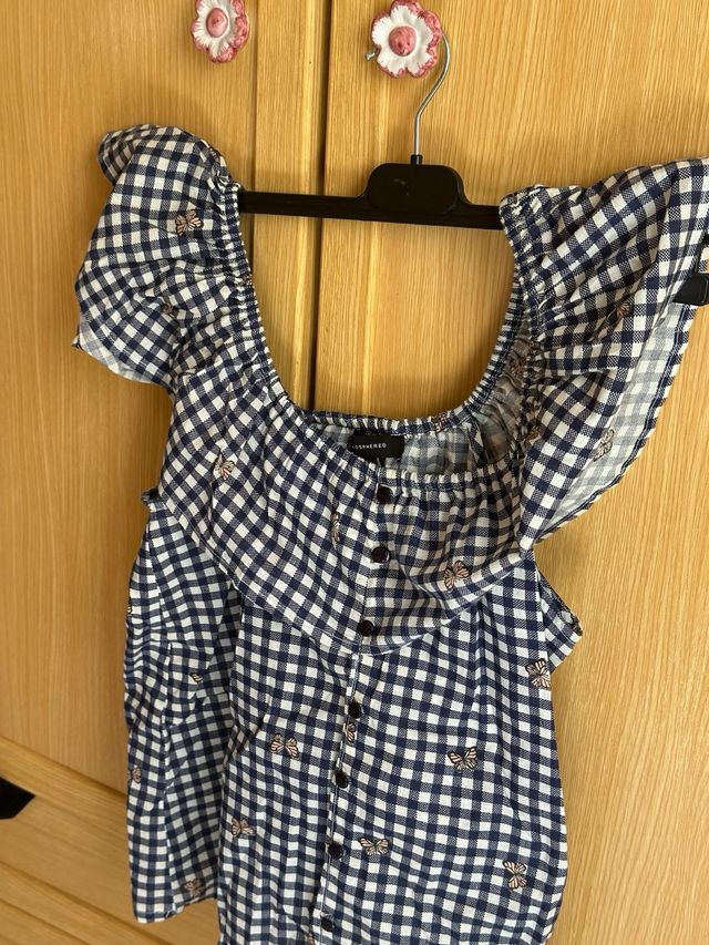 Blusa de cuadros azul marino y blanco con mariposa