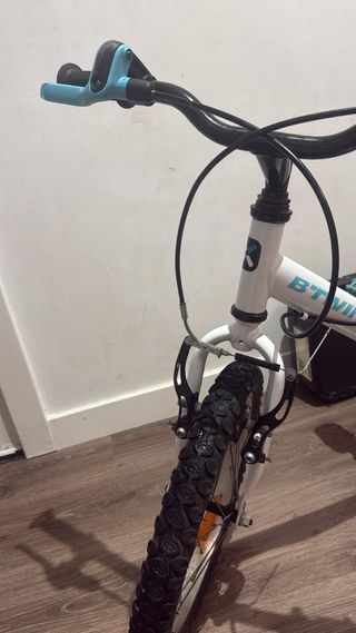 Bicicleta infantil  16 pulgadas btwin100con rodine