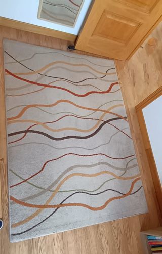 Alfombra salón beige y naranja