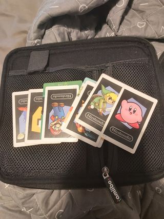 Nintendo 3DS XL blanca, fundas, juegos y cargador