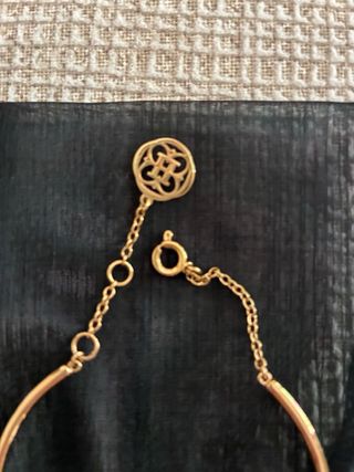 Pulsera Carolina Herrera dorada perla