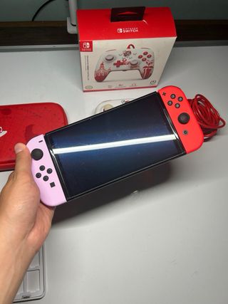 Nintendo Switch Oled rosa e rossa + giochi