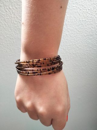 Pulsera espiral marrón-dorada