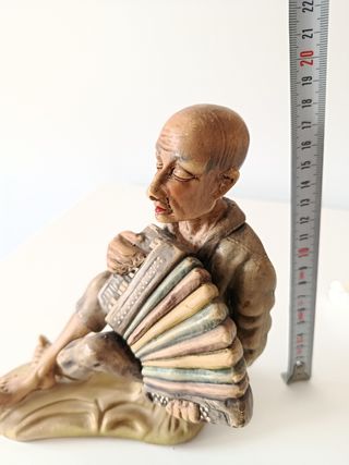 Figura porcelana acordeonista