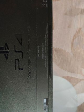 PS4 (PlayStation 4) negra y ventilador mando juego