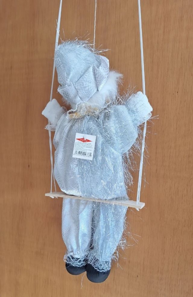 Muñeco payaso blanco y plateado