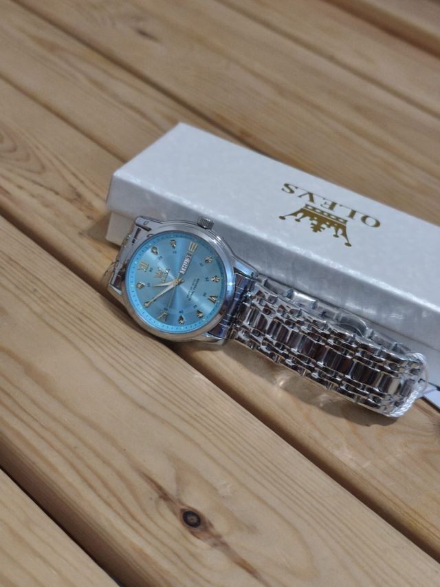 Reloj OLEVS azul y plata