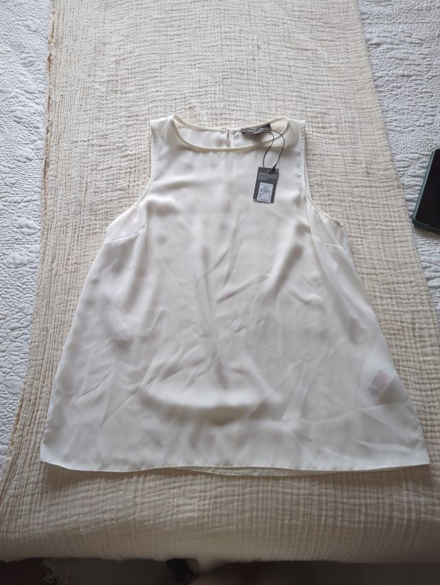 Blusa/ Top
blanco roto de Primark talla 38.
