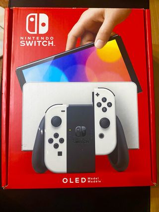 Nintendo Switch OLED bianco e nero + 3 giochi.