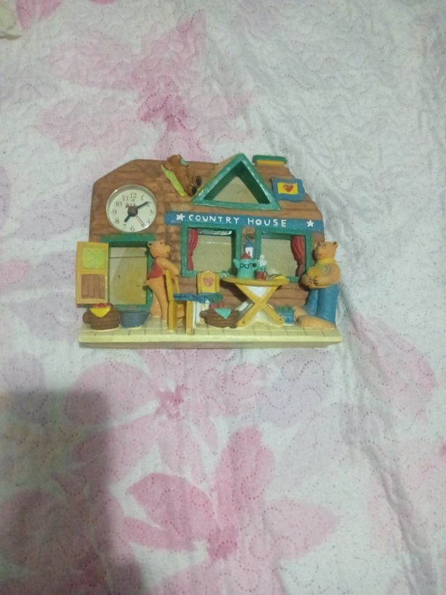 Reloj decorativo con marco de fotos